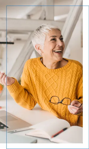 Professional woman smiling at her desk