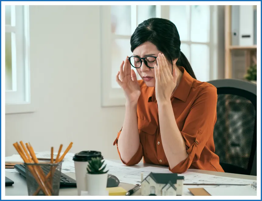Professional woman feeling stressed at work